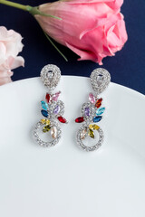 Close up of diamond earrings. space for your text.