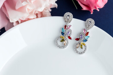 Close up of diamond earrings. space for your text.