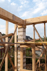 interior of a country house under construction. Site on which the walls are built of gas concrete blocks with wooden formwork
