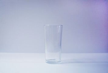 the is one empty glass, which doesn't contain any liquid
