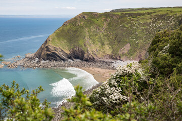 Shipload Bay on Devon's coast with waves rolling in