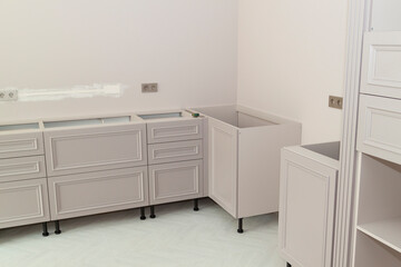 View of the new lower kitchen drawers with doors in the process of installation and electrical...