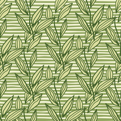 Fototapeta premium Lined geometric seamless pattern with leaves. Floral artwork in green tones with stripped background.