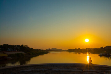 Sunset at Origin of Chao Phraya river begins at the confluence of the Ping and Nan rivers at Nakhon...