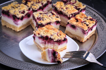 Homemade Blueberry Pie Bars. Delicious Crumble Bars on dark background.