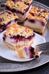 Homemade Blueberry Pie Bars. Delicious Crumble Bars on dark background.
