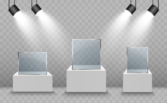 Glass showcase for the exhibition in the form of a cube. Background for sale illuminated by spotlights. Museum glass box isolated advertising or business design boutique. Exhibition hall.