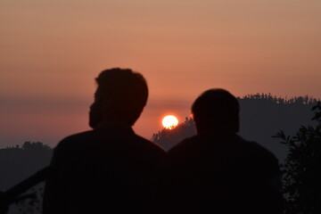 Beautiful Sunset and two people in Nainital