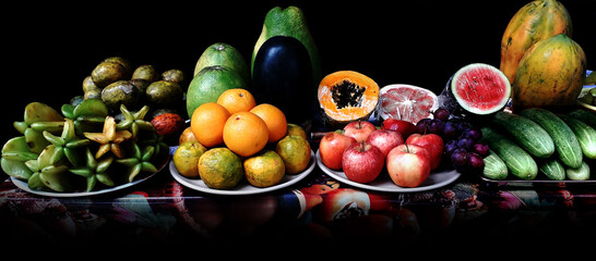 Fresh fruits on a dark Background