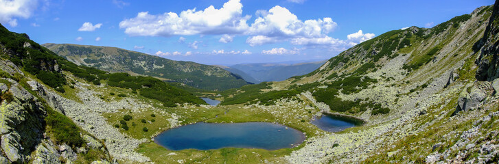 Galcescu Lake glacier cauldron - located in an alpine valley between rocky mountain sides. Parang...