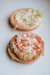Burger preparation ingredients tomato, mayonnaise