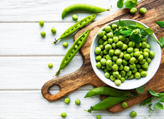 Green peas in white bowls
