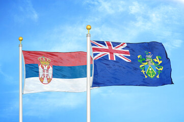 Serbia and Pitcairn Islands two flags on flagpoles and blue sky
