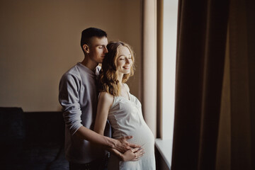 Young family concept, pregnancy