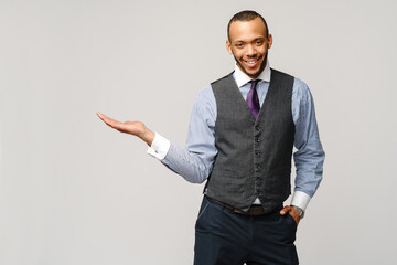 professional african-american business man - presenting points a hand at copy space