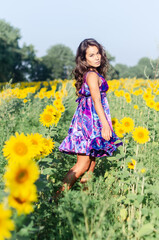 free girl walks in the field.