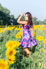 free girl walks in the field.