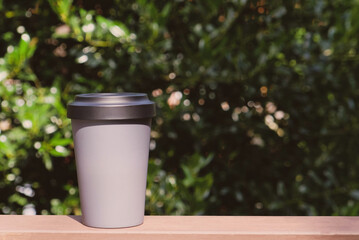 Reusable eco-friendly grey bamboo cup with lid.