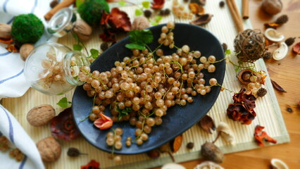 white currant on the plate, still-life with food, tasty currant