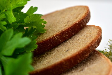 slices of bread, parsley on a white background