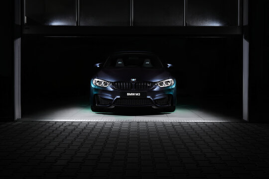 Katowice / Poland - 12/03/2016: The front of the BMW M3 30 Jahre Edition standing in a dark garage. This is a limited edition created to celebrate the 30th anniversary of the M3. 500 pcs only, 450 hp.