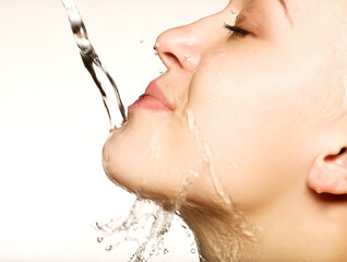 beautiful woman with clean skin with splash of water