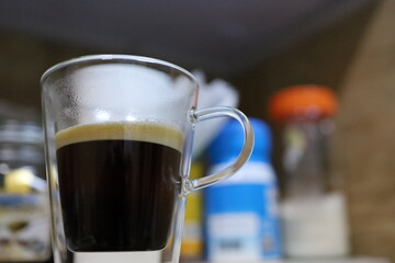 glass coffee cup with diffuse background