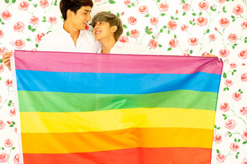 Fototapeta na wymiar young lover Asian men were happy together over rose background . LGBT gay couple love concept.