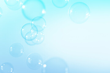 Blue soap bubbles float background, with copy space a white background