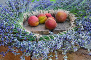 Homemade lavender wreath and apricots. Close up.