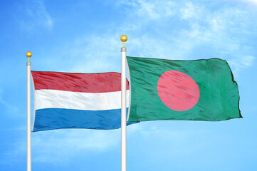 Netherlands and Bangladesh two flags on flagpoles and blue sky