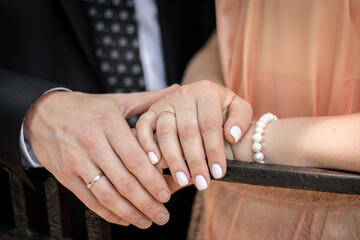 bride and groom holding hands