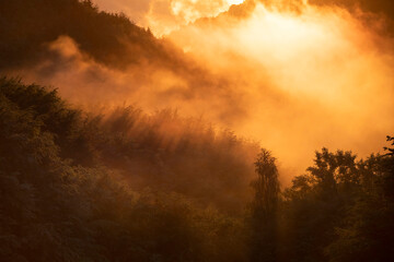 Magic foggy sunset in transylvaninan mountains.