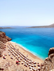 A view from the top of the Kaputas Beach, full of beach on a summer day. Kas, Antalya Turkey