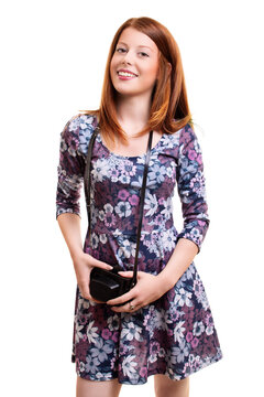 Young Girl In Flowery Dress Holding Old Fashioned Camera