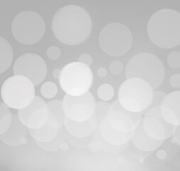 Abstract background,blurred lights bokeh on gray and white background.bokeh effect,Festive light background,gray and white  background