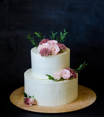 two tiered wedding Cream cheese cake with roses and blueberries