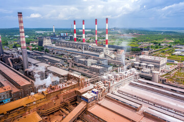 Obraz premium Smoke from pipes of metallurgical plant. View from above. Environmental pollution problem