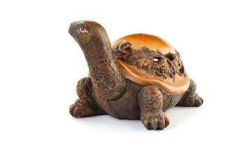 Naklejka premium Wooden turtle figurine isolated on white background.