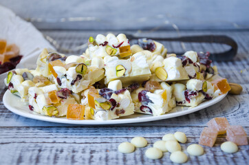white chocolate fudge with pistachio, cashews, marmalade and dried cranberries
