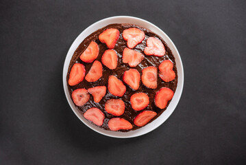 Homemade chocolate cake with strawberries. View from above