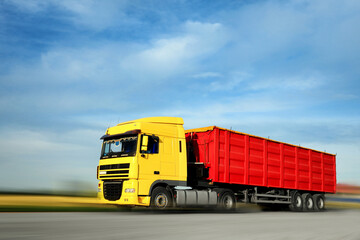 Fototapeta na wymiar Logistics concept. Truck on country road, motion blur effect