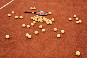 Tennis balls scattered around the court