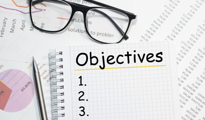 OBJECTIVES writing on the Notepad view from above business concepts
