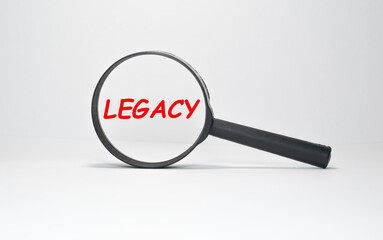 Legacy text, inscription, phrase is written in a notebook that lies on a dark table and a pen. Business concept.