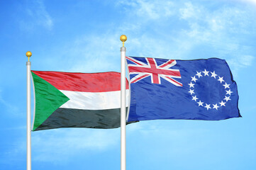 Sudan and Cook Islands two flags on flagpoles and blue sky
