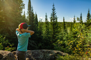 Fototapeta na wymiar Mother and son, hiking and bird watching in Voyageurs National Park, Minnesota