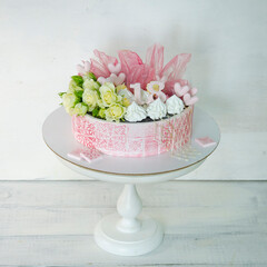 pink stencil cake with roses and merengue for anniversary