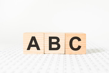 Isolated children's building blocks spelling a b c