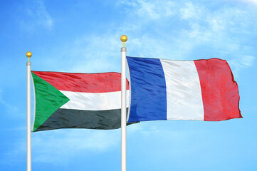 Sudan and France two flags on flagpoles and blue sky